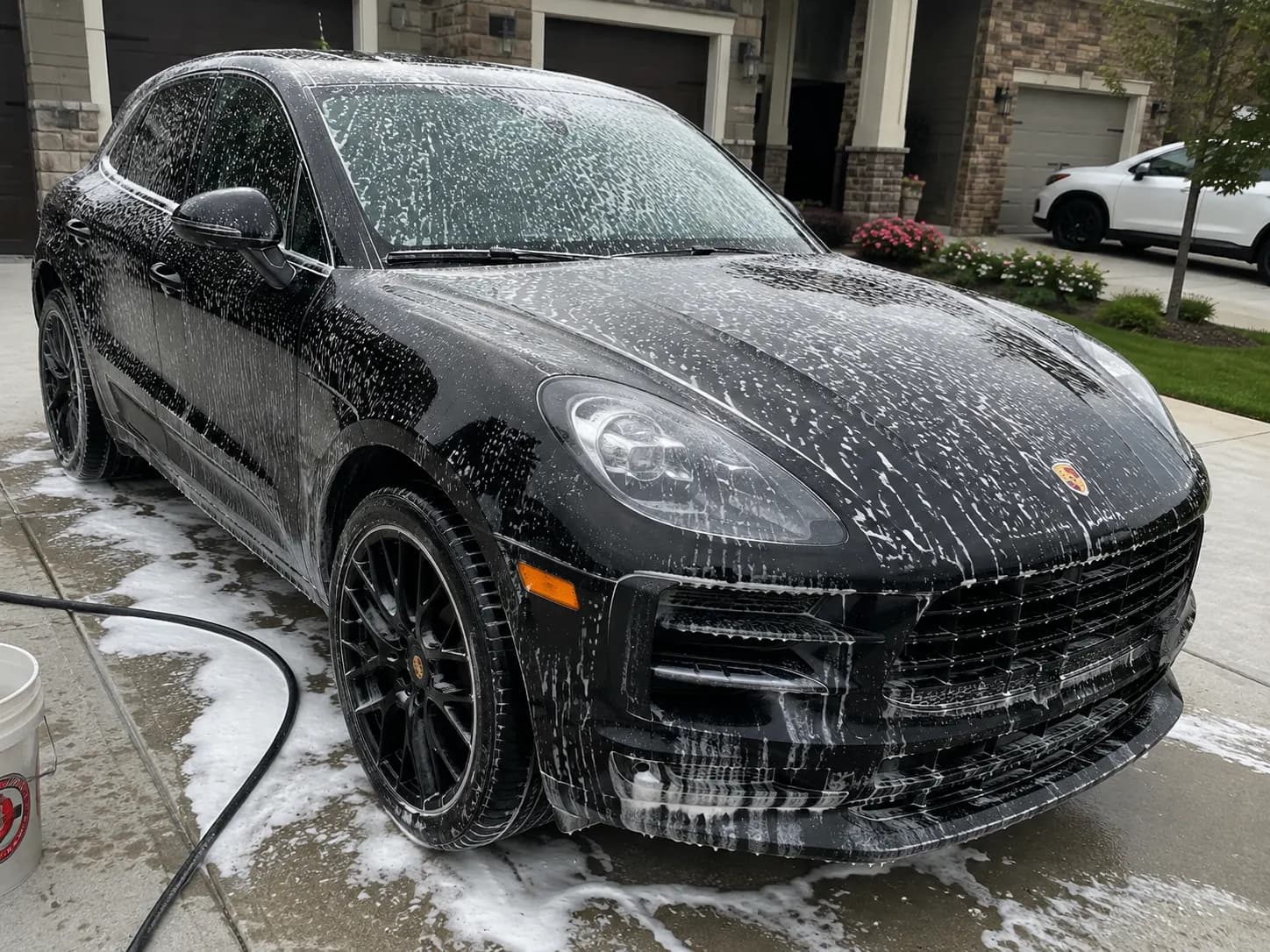 Freshly detailed black vehicle with water beads